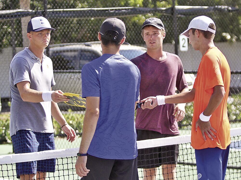 3. Luke Dockter and Jake Sponsler touch rackets .tif